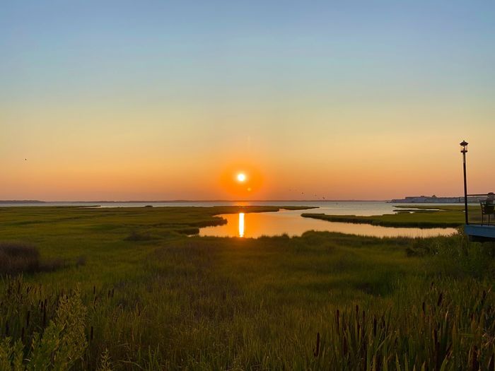 Scenic view of sea against sky during sunset