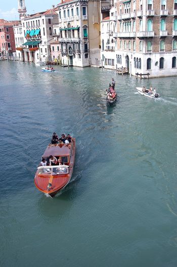 High angle view people on boats sailing in grand canal