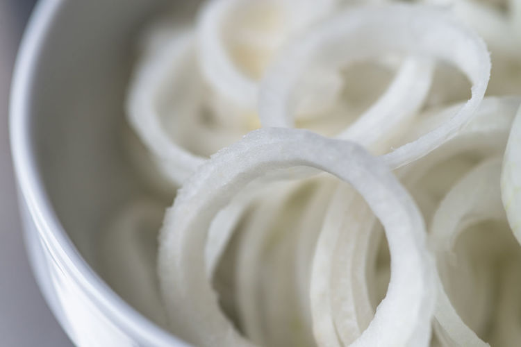 Close-up of sliced onions in container