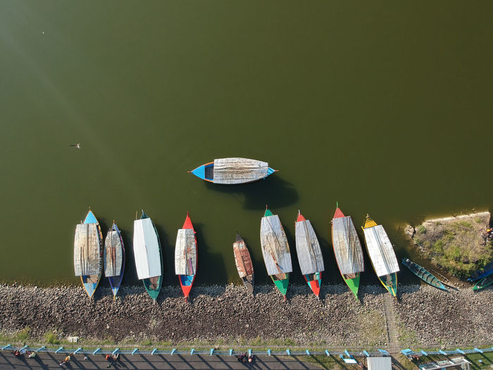 High angle view of colorful boats moored at lakeshore