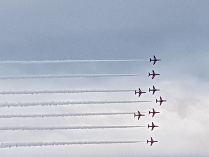 Low angle view of airplanes against sky during airshow