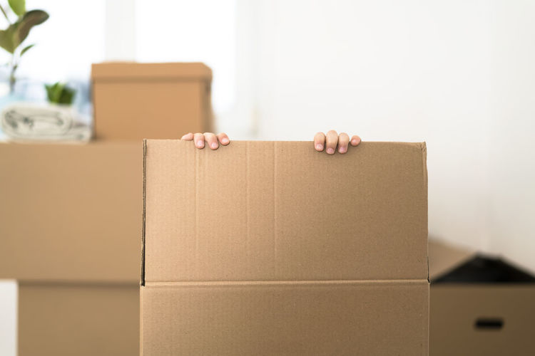 Close-up of cardboard box against white background