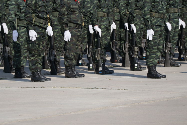 Low section of soldiers standing on street