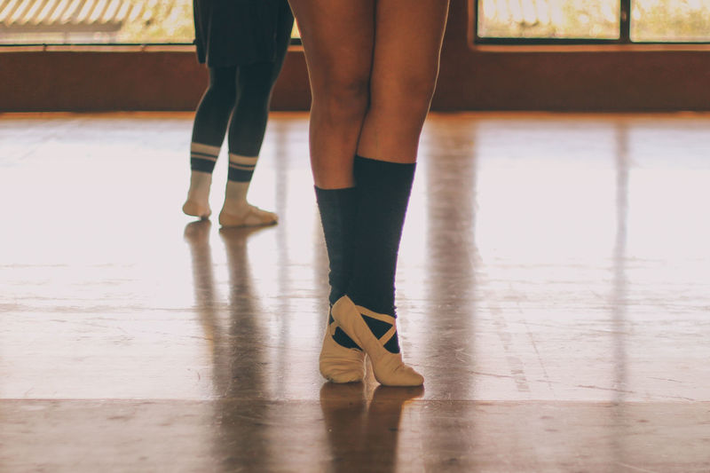 Low section of women in dance studio