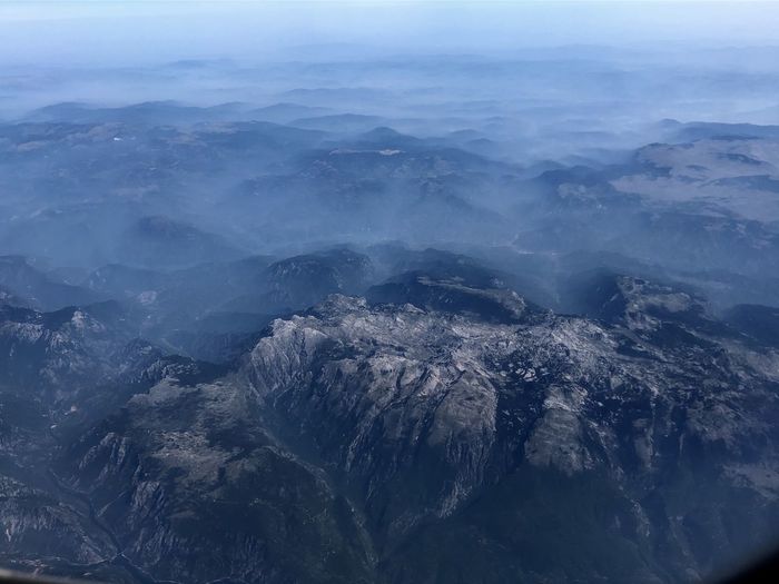 High angle view of rocky mountains against sky