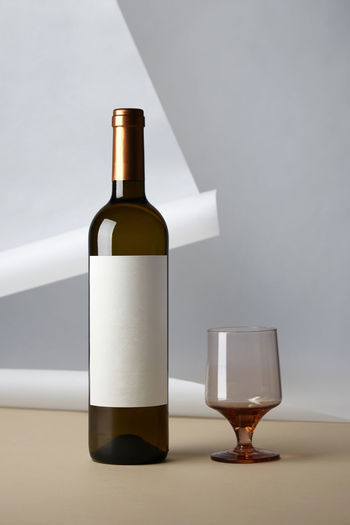White wine bottle with glass