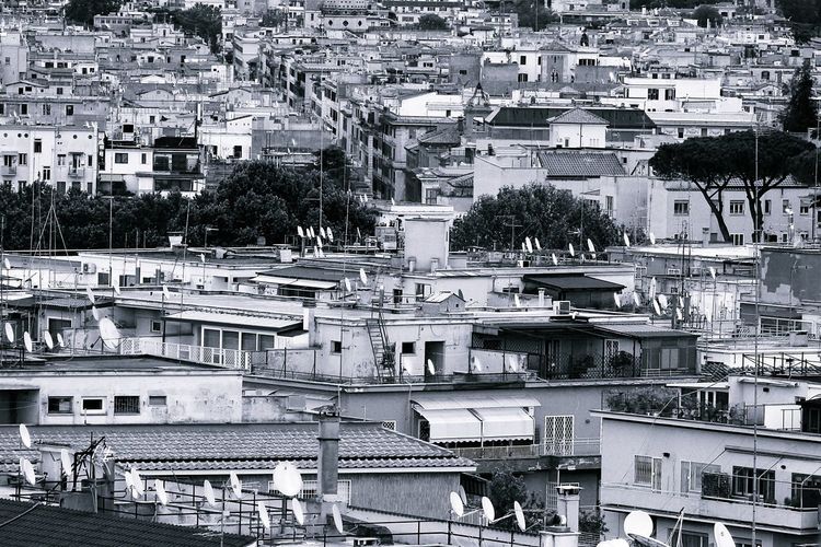 Panorama of rome, residential area, houses, roofs, terraces and antennas, black and white photos.