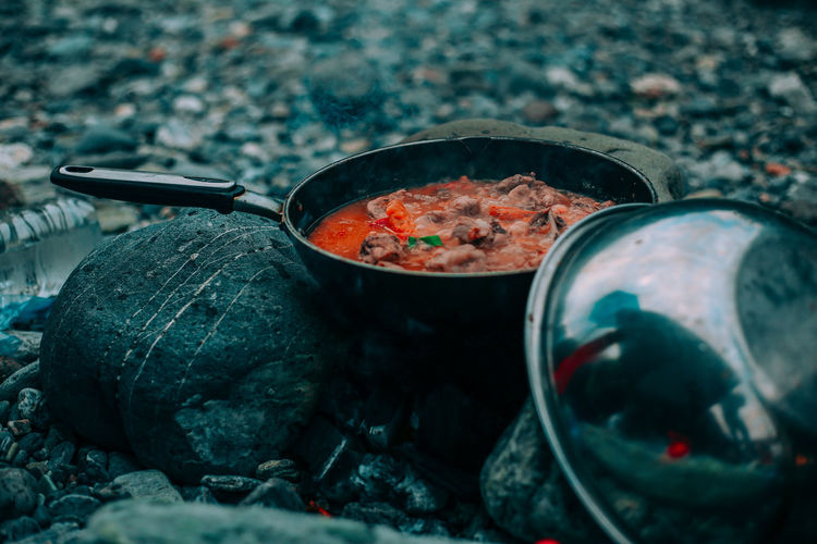 Close-up of food cooking in pan on camping stove