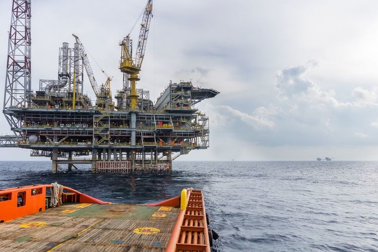 An oil production platform viewed from an anchor handling tug boat at offshore terengganu oil field