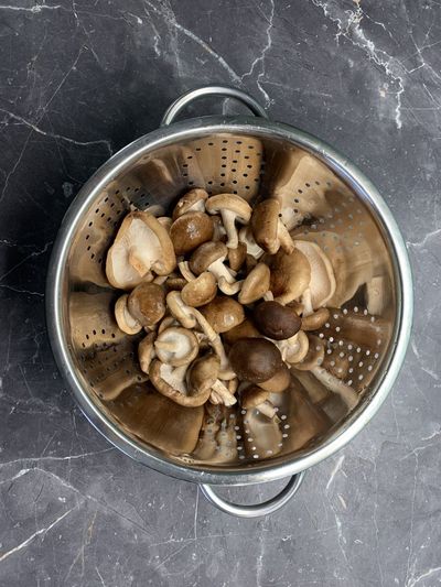High angle view of mushrooms in bowl on table