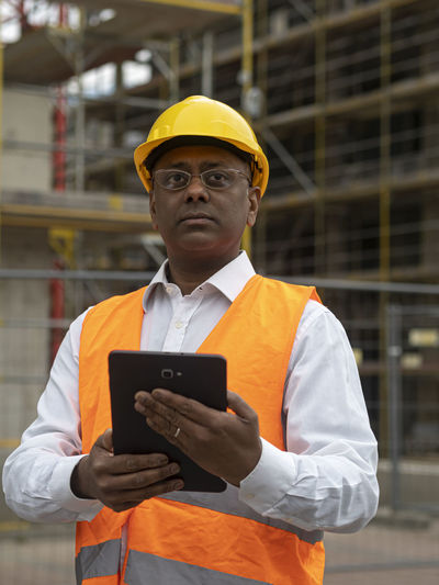 Portrait of man using digital tablet
