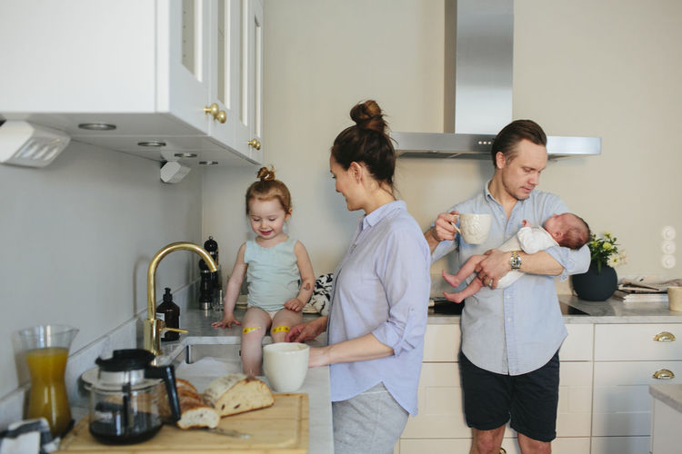 Group of people in kitchen at home