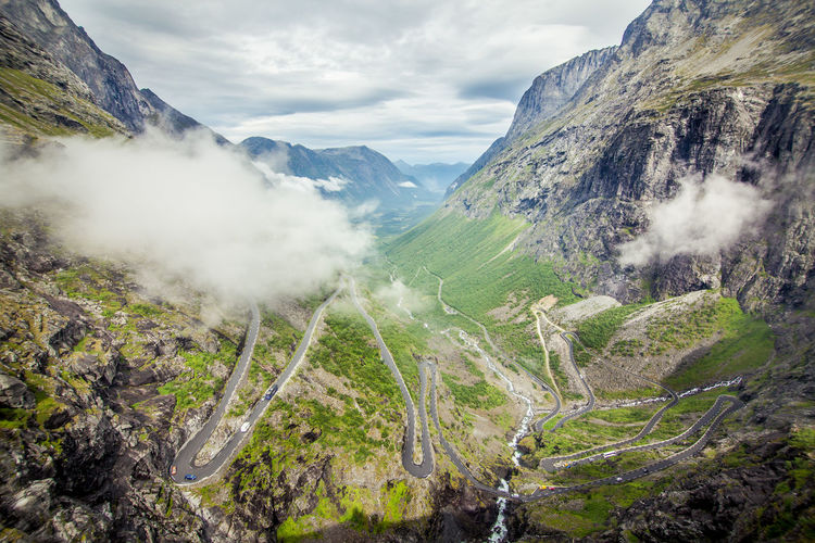 High angle view of road amidst mountains against sky