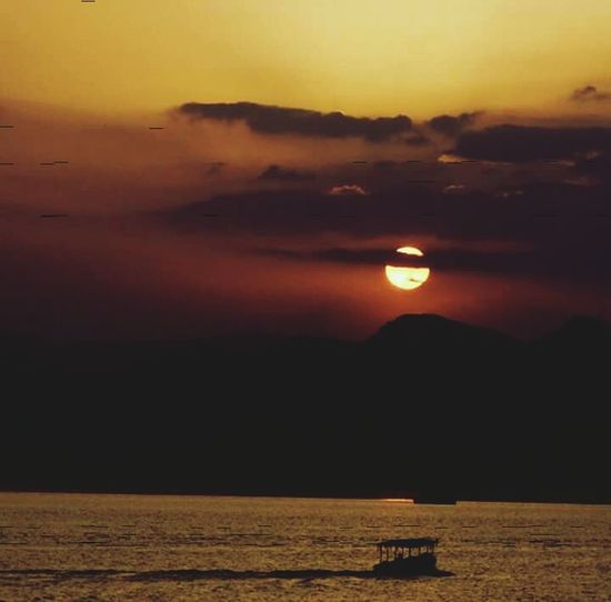 Scenic view of sea at sunset