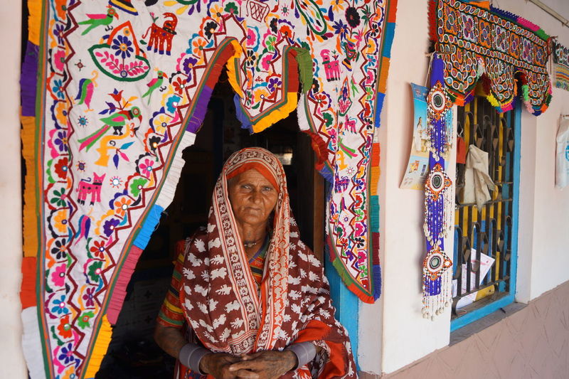 Portrait of woman standing at entrance