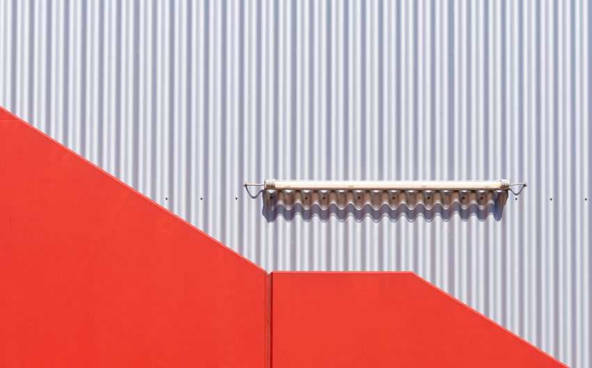 Full frame shot of red and silver wall