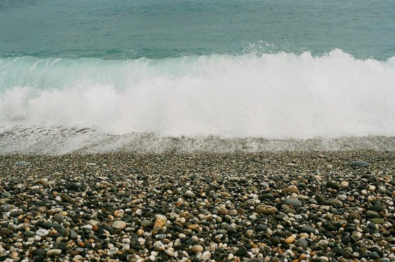 Waves splashing on rocks at beach