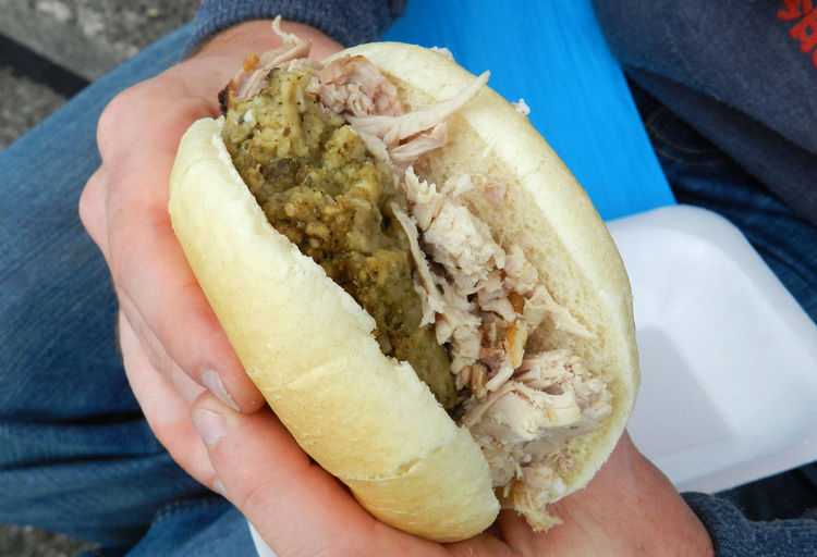Close-up of hand holding hot dog