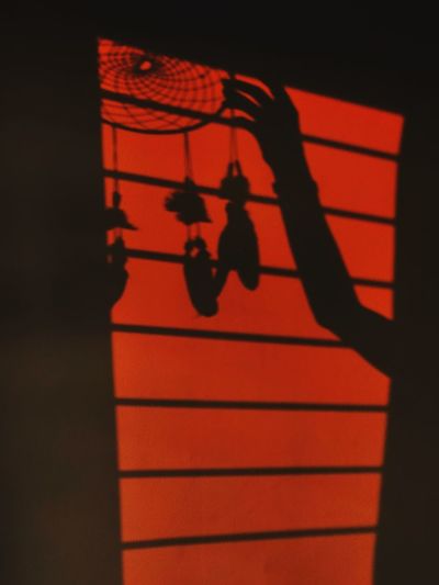 Close-up of orange shadow on wall