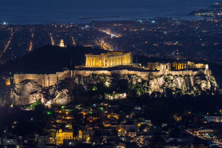 High angle view of illuminated buildings in city