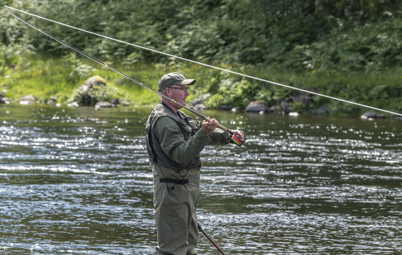 Man fishing in lake
