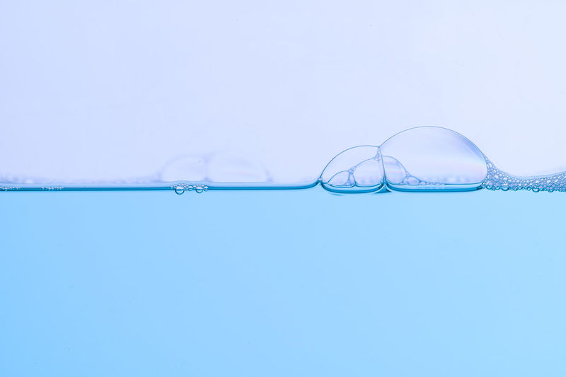 Close-up of bubbles against white background
