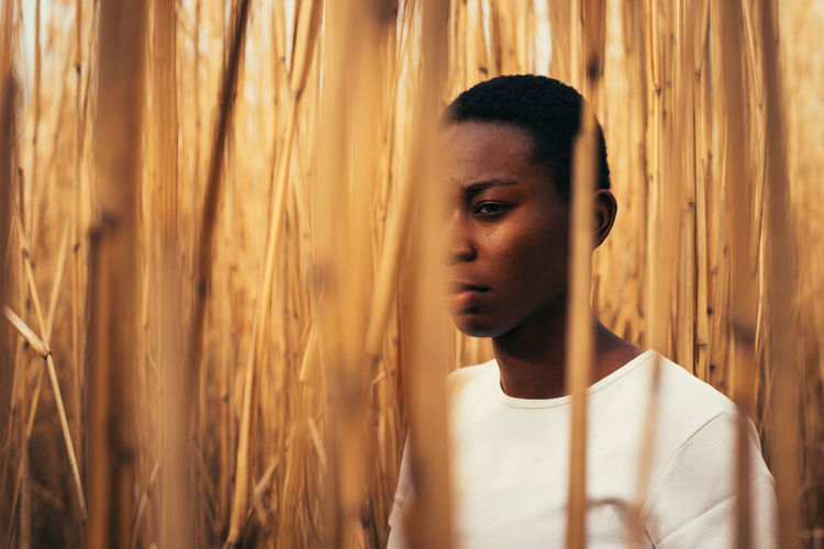 Portrait of young woman looking away