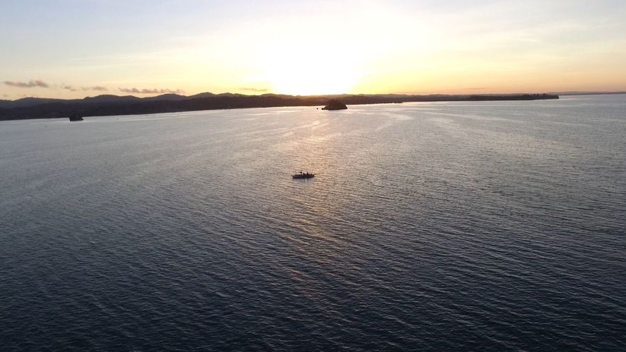 Scenic view of sea at sunset