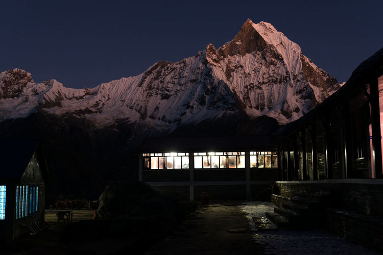 View of building against mountain at twilight