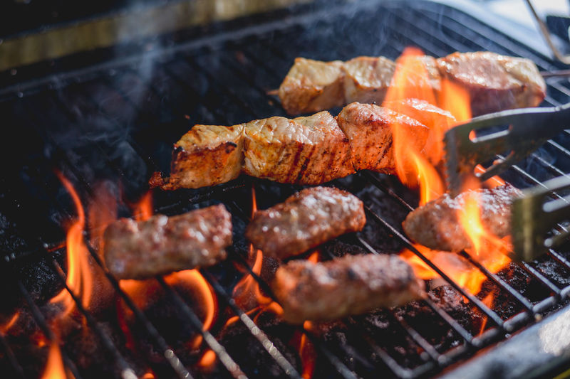 Close-up of meat cooking on barbecue grill
