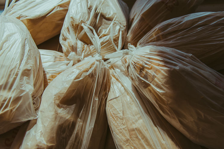 Full frame shot of plastic bags and bread