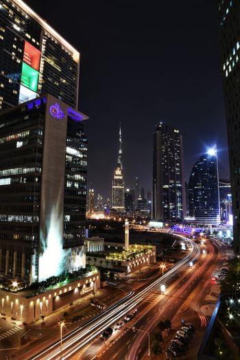 High angle view of illuminated buildings in city at night
