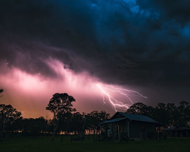Panoramic view of lightning against sky during sunset