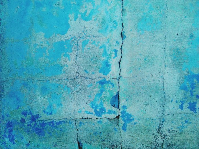 Full frame shot of weathered blue wall