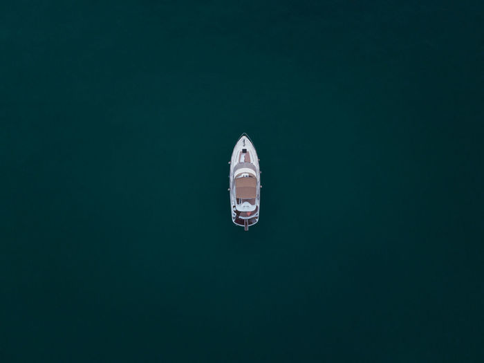 Aerial view of yacht moored in lake