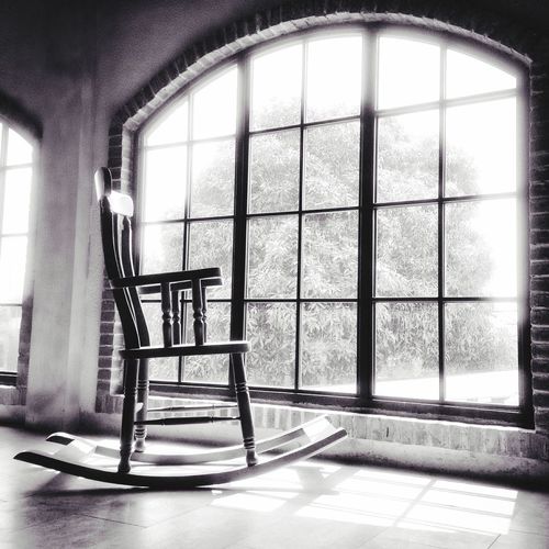Empty chairs and window