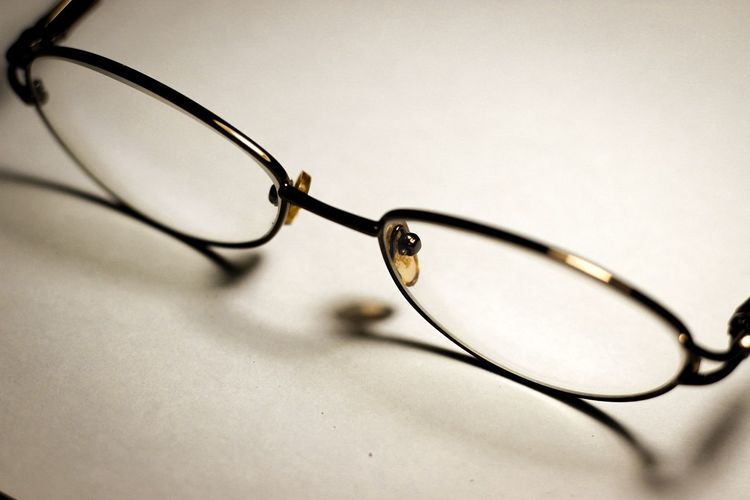 Close-up of eyeglasses on glass