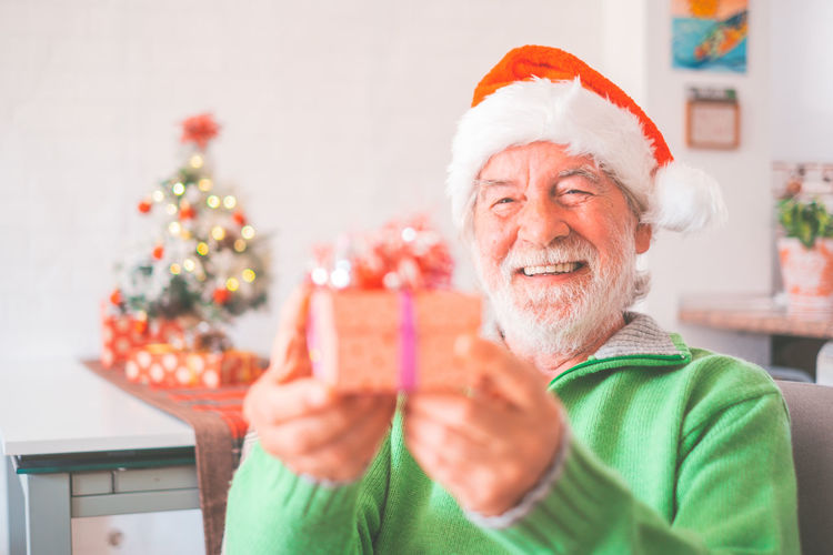 Portrait of woman holding christmas presents