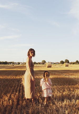 Full length of woman on field against sky