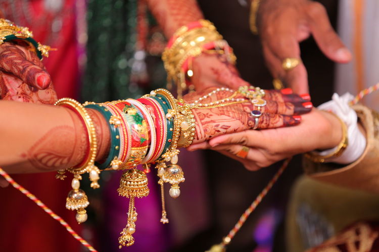 Close-up of bride and bridegroom hands during wedding ceremony