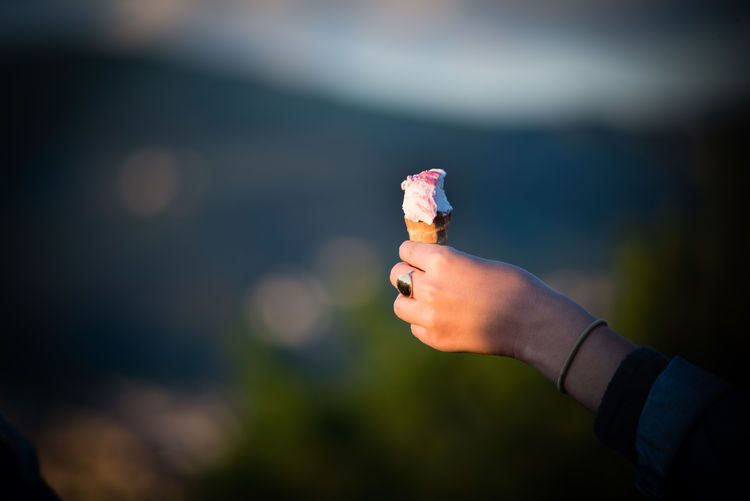 Cropped image of woman holding ice cream cone