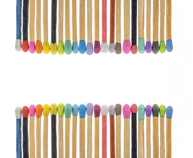 Matchsticks various colors on white background
