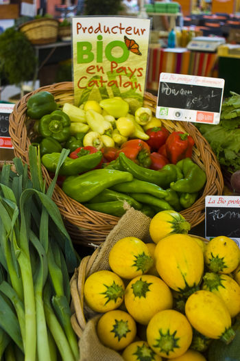 Price tags on vegetables at market stall