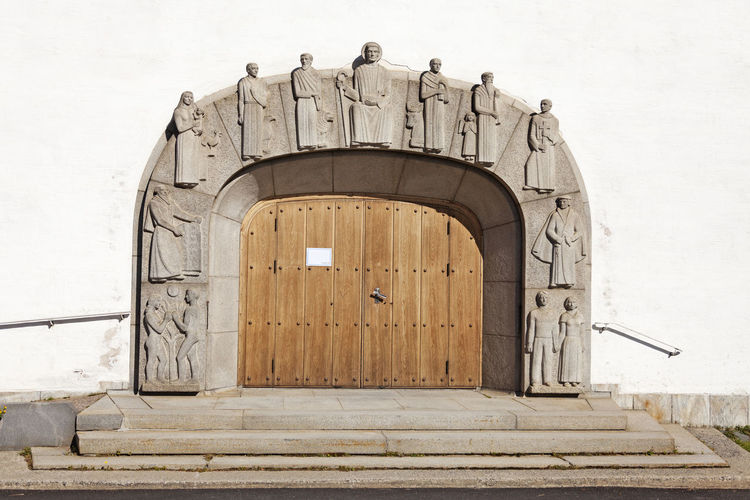 Church gate with interesting stone figures in relief