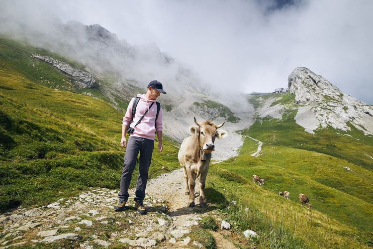 Full length of man standing on mountains