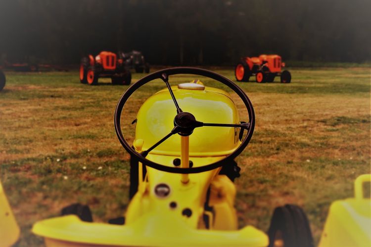 Close-up of toy tractor on field