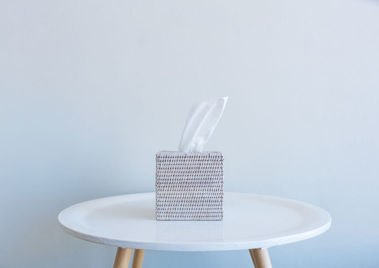 Close-up of cake on table against white background