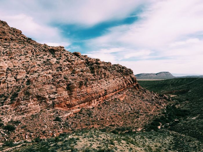 View of red rock canyon national conservation area against cloudy sky