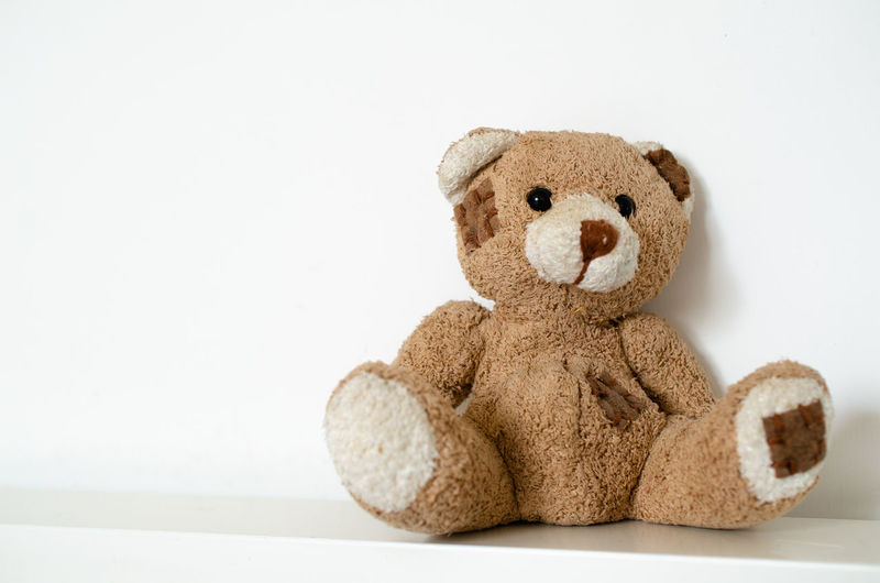 Close-up of stuffed toy against white background