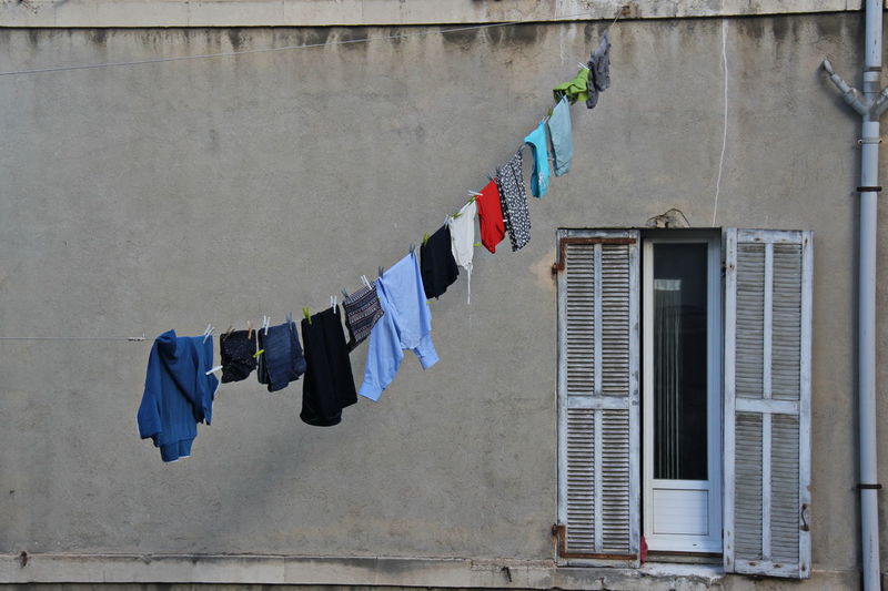 Clothes drying on wall against building